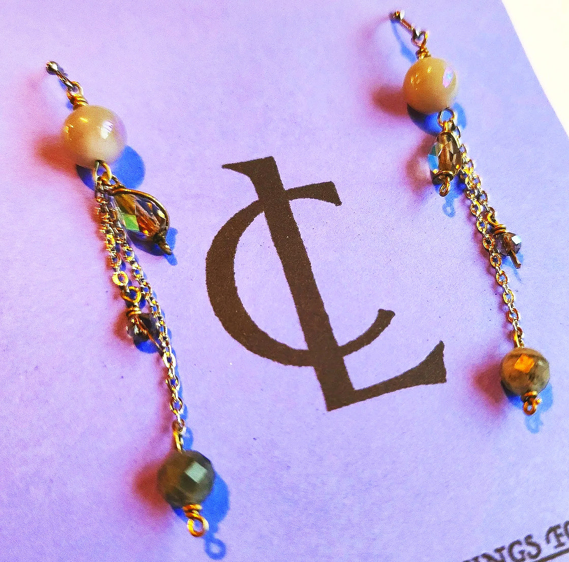 Earrings: Labradorite beads, glass bead on steel chain. 2.5 in drop CL E4