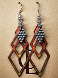 Earrings: Enameled copper element with steel charm 1.75 in drop CL E6