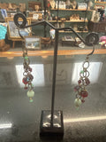 Earrings: Red Czech glass beads with pale green beads. Brass chain. E29