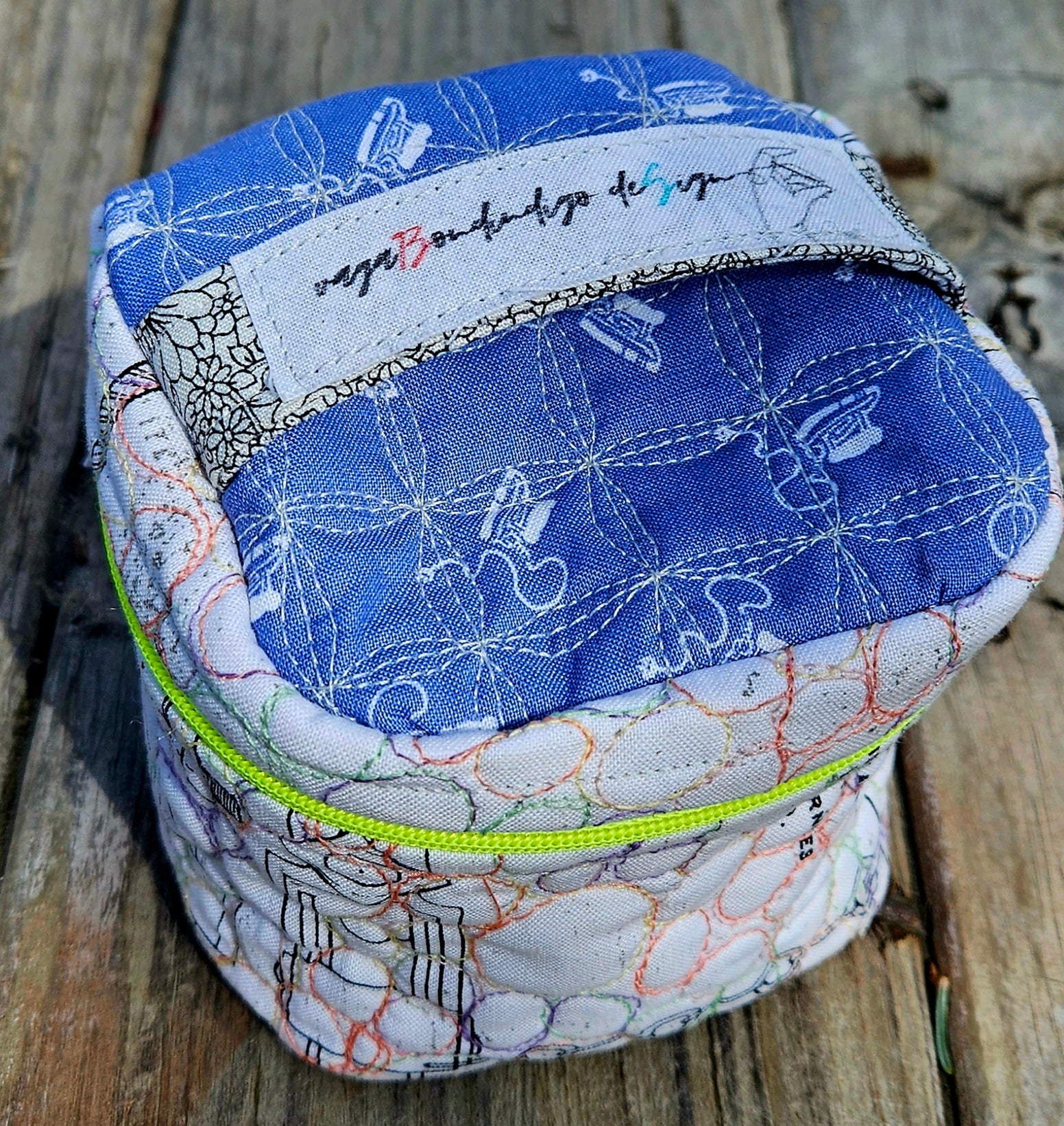 Large quilted zip pouch with zip pull