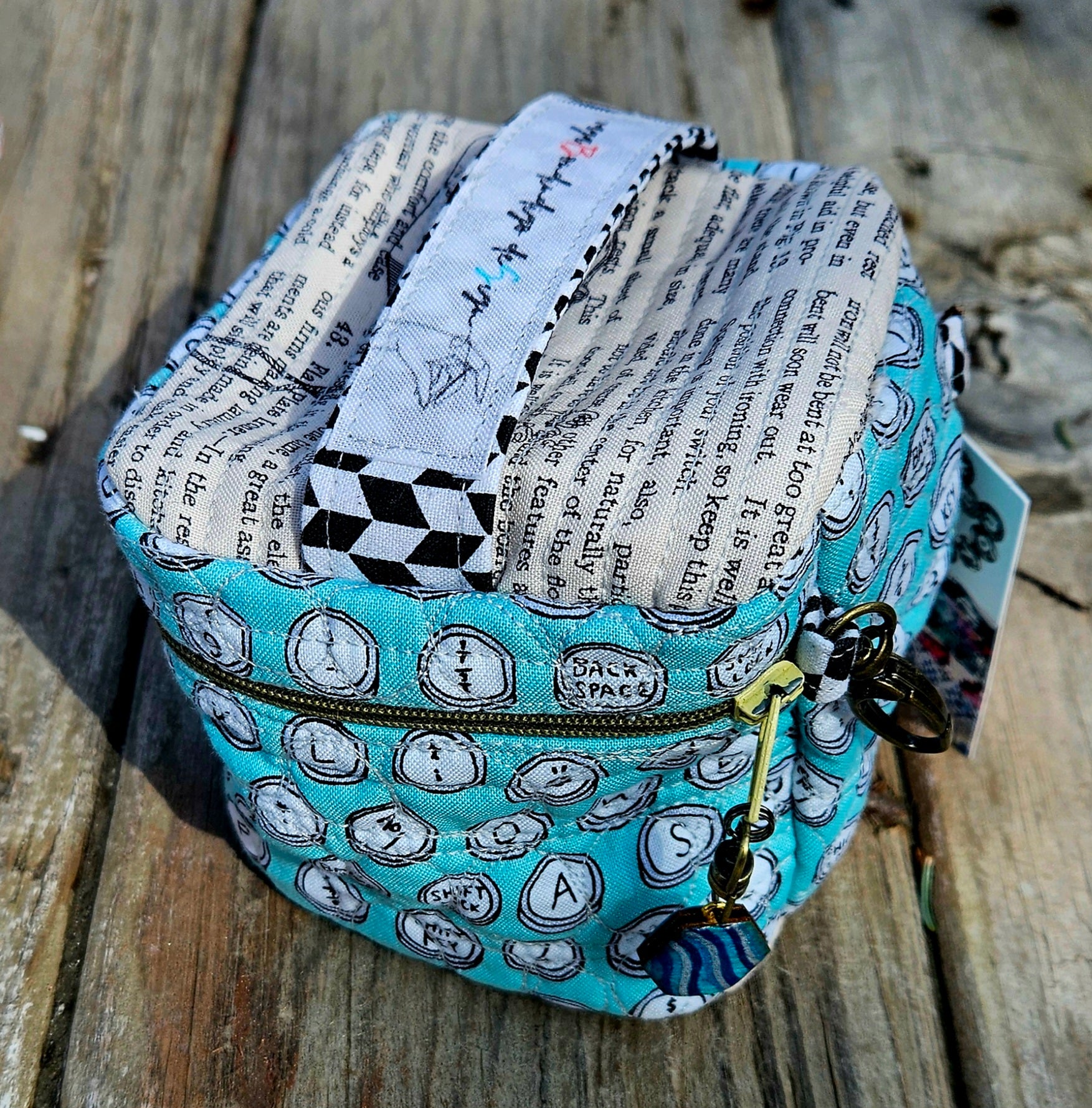 Large quilted zip pouch with zip pull