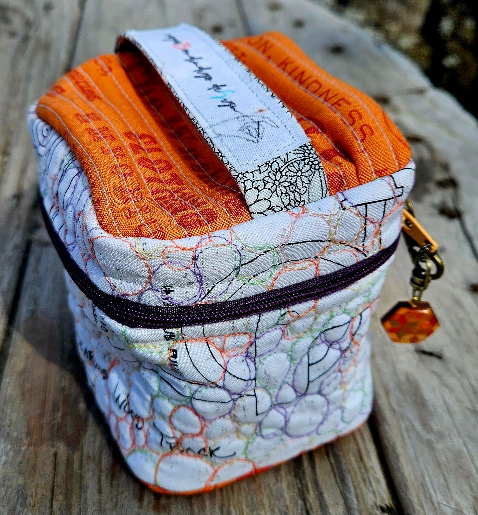 Large quilted zip pouch with zip pull