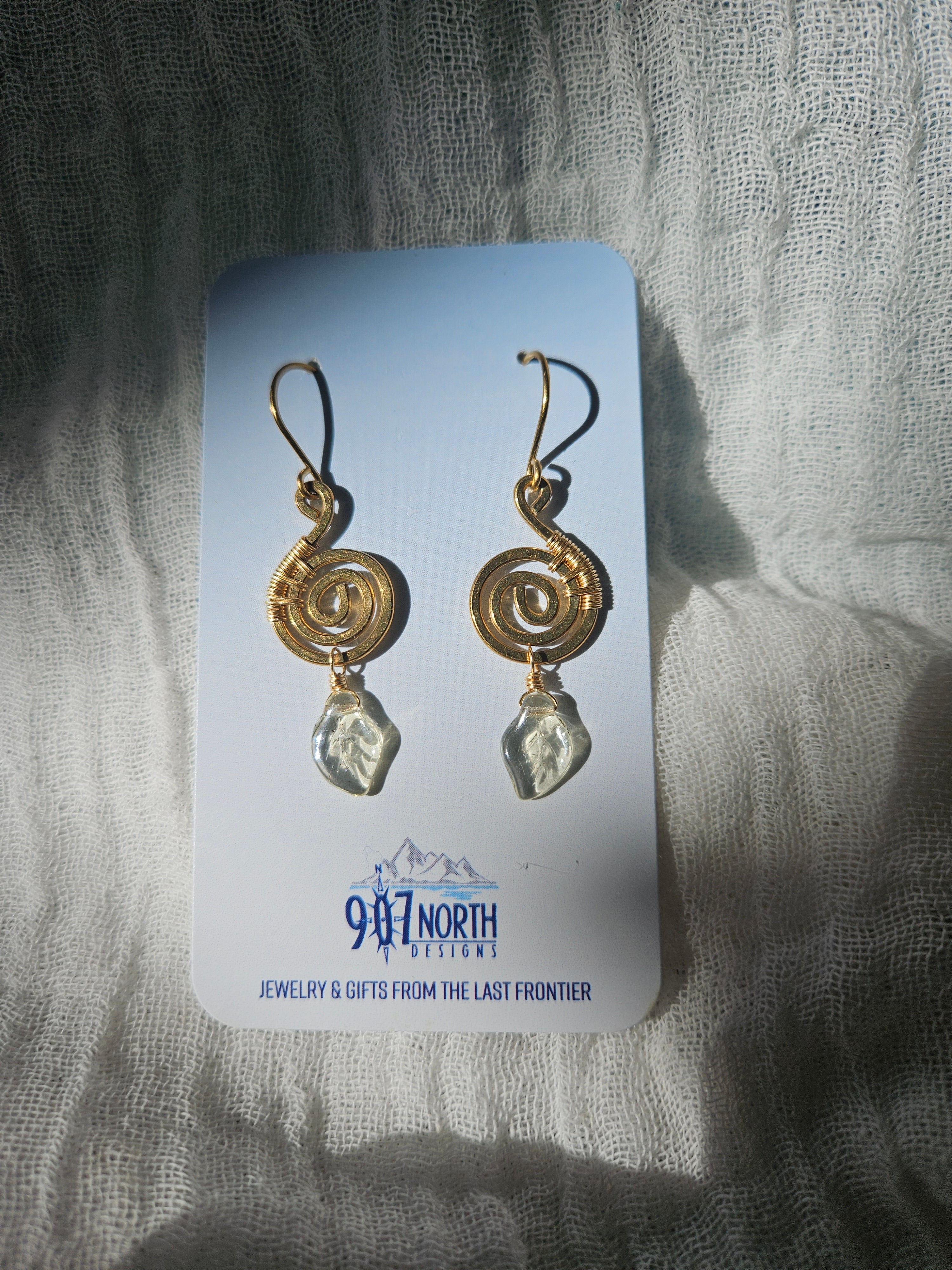 A4 907 lmm Earrings: Brass Swirls with Czech glass leaves