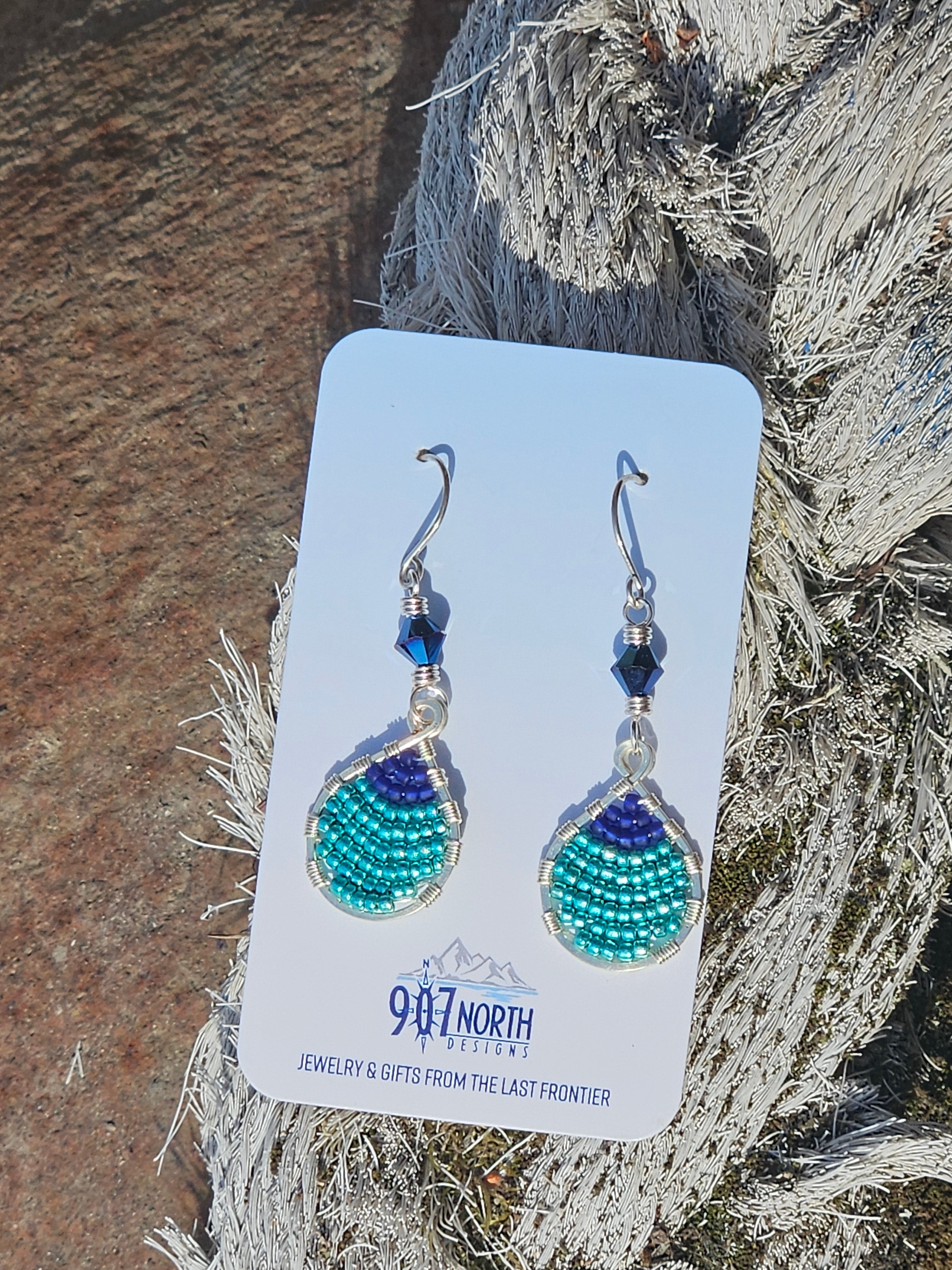 #1276 907 lmm Hand beaded buoy earrings blue
