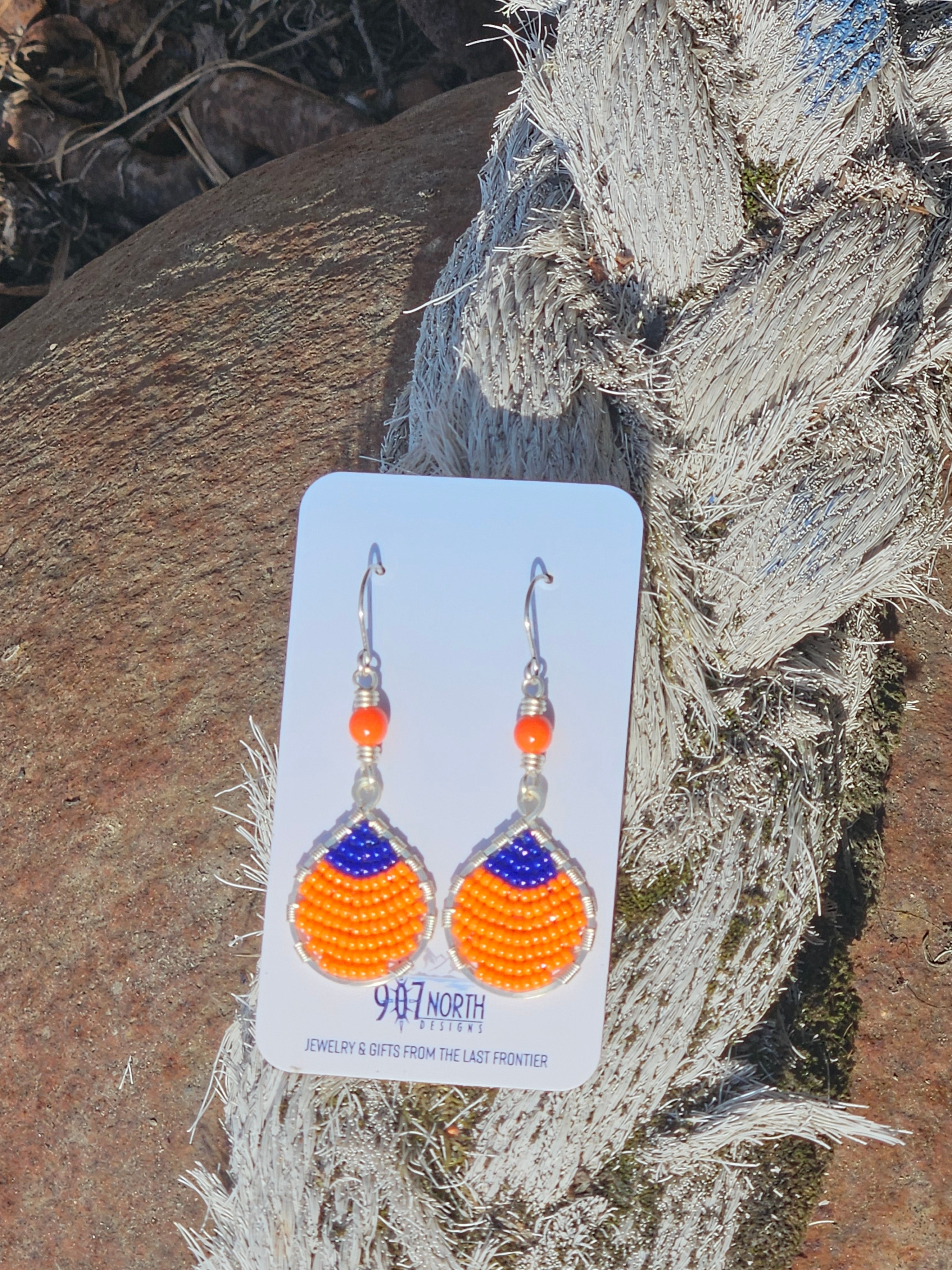 #1098 907 lmm Hand beaded buoy earrings orange