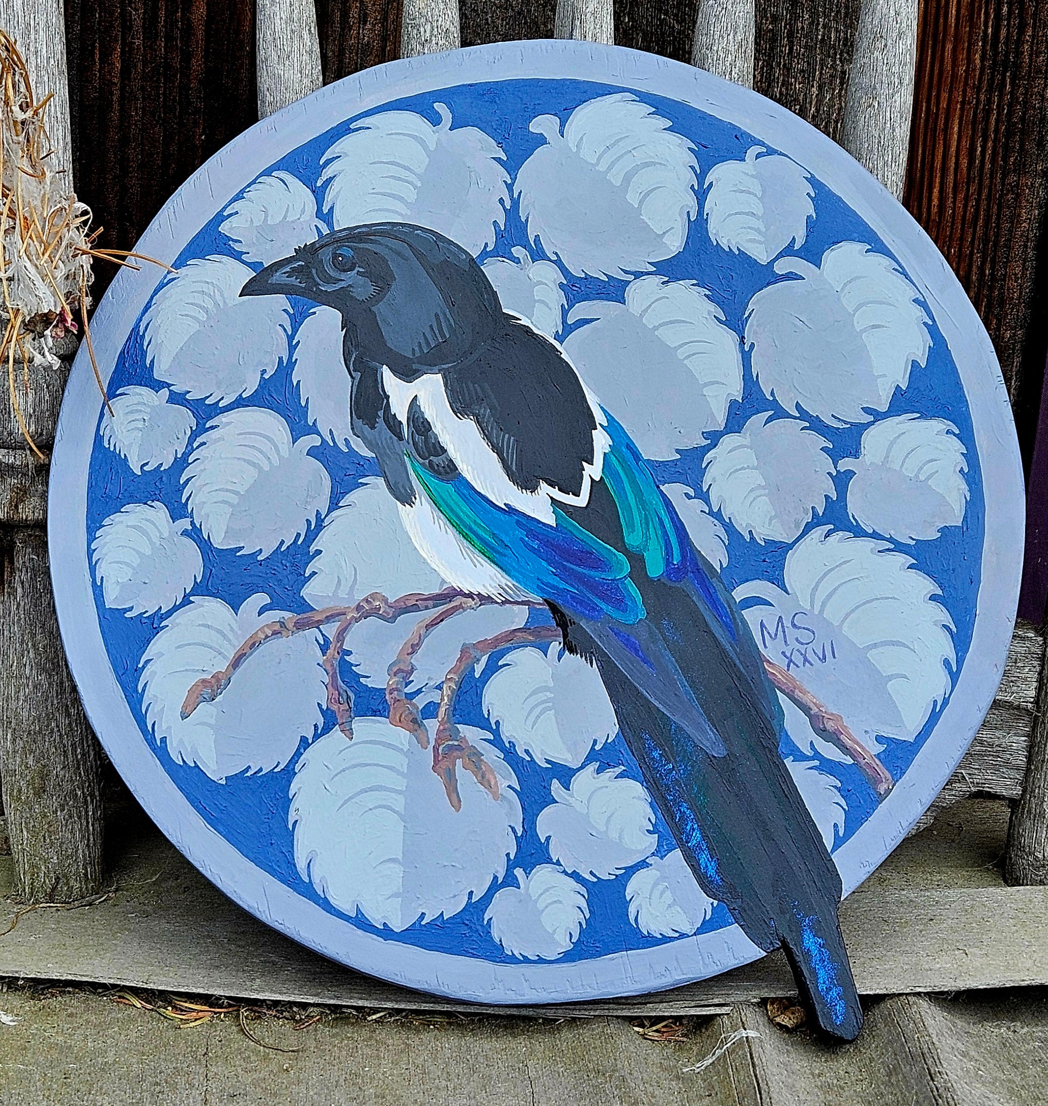 Magpie Messenger: paint on wood carving 13 inch diameter