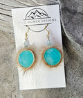 Seal skin earrings with blue glass beads