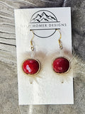 Seal skin earrings with red glass beads