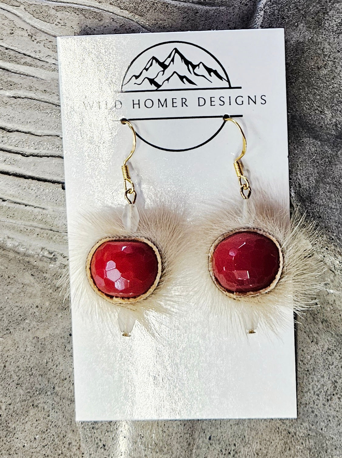 Seal skin earrings with red glass beads