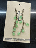 Earrings: Brass antiques chain with soft green beads. E18