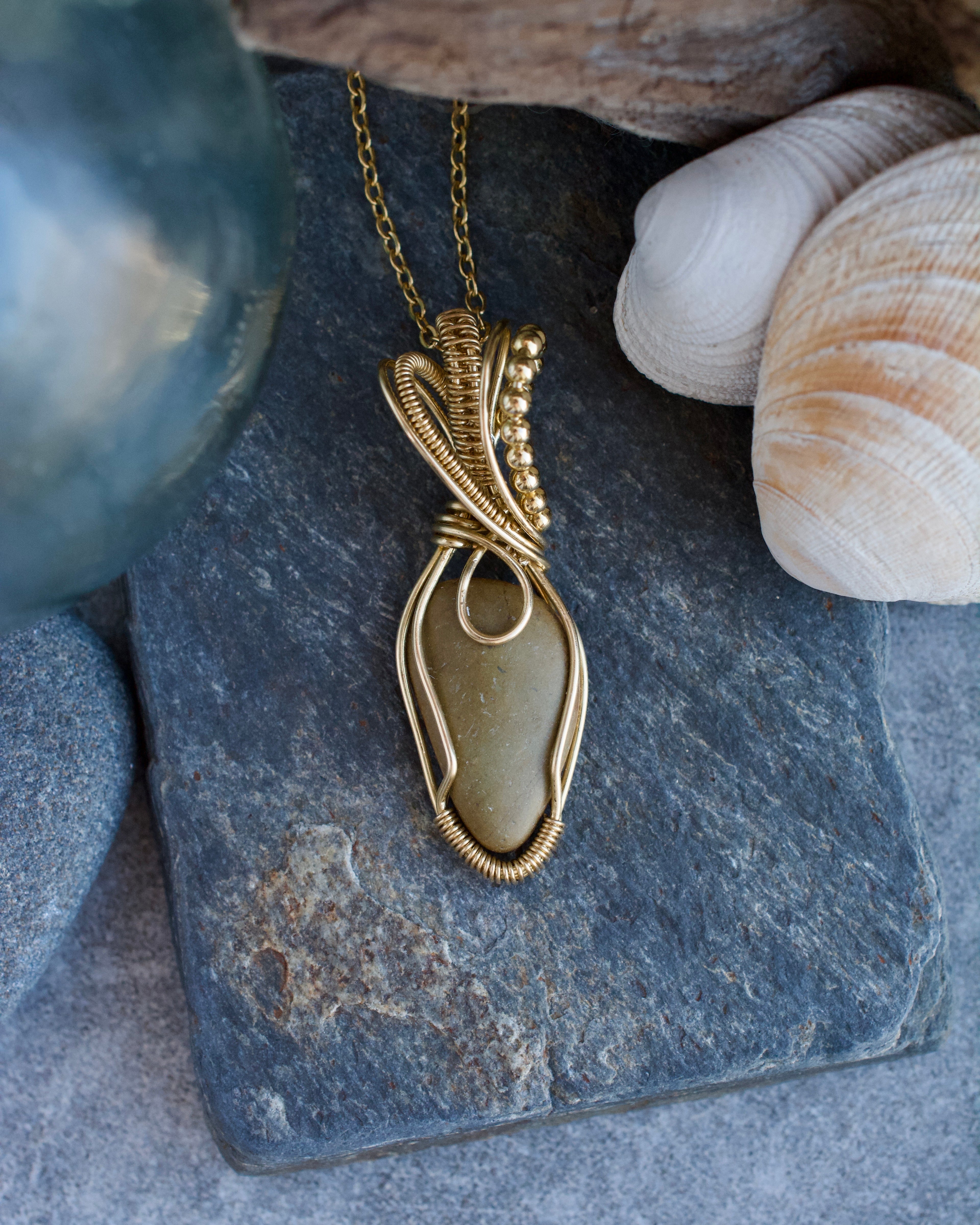 (#294 ws) Necklace: Clam Gulch stone, brass wrapped, 18 inch stainless chain