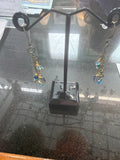 Earrings: Faceted glass beads in blues. Brass chain. E26