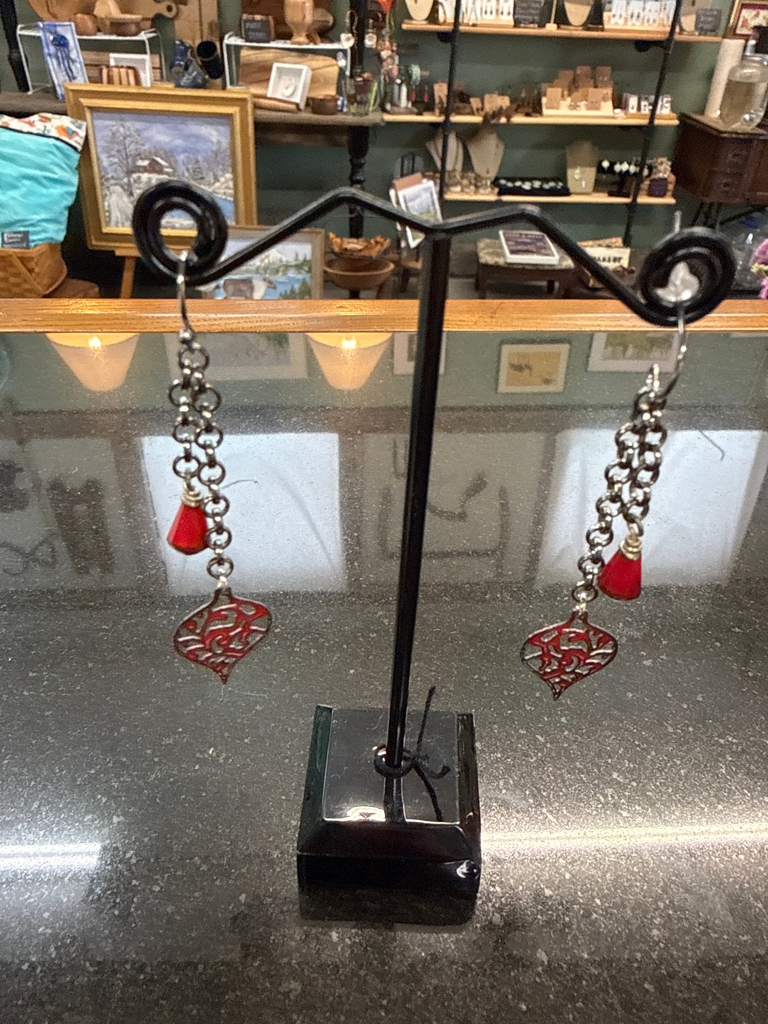Earrings: Red hand enameled filigree copper with red Czech glass on antiqued steel chain.  E11