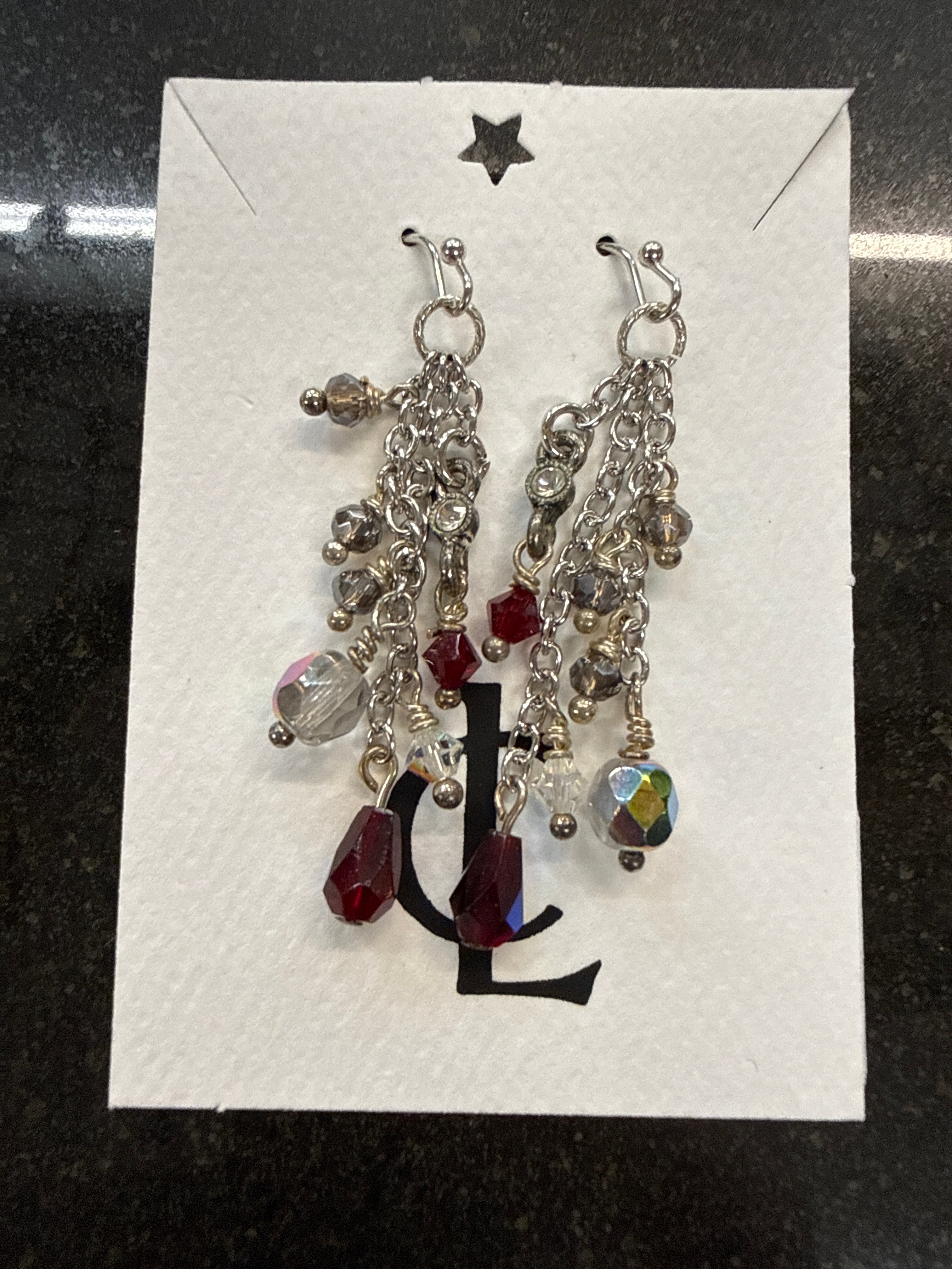 Earrings: Red, white grey, opalescent glass beads on steel chain.  E9