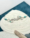 #1029 907 lmm Silver Swirly Square Knot Bracelet, aqua beds, lob clasp