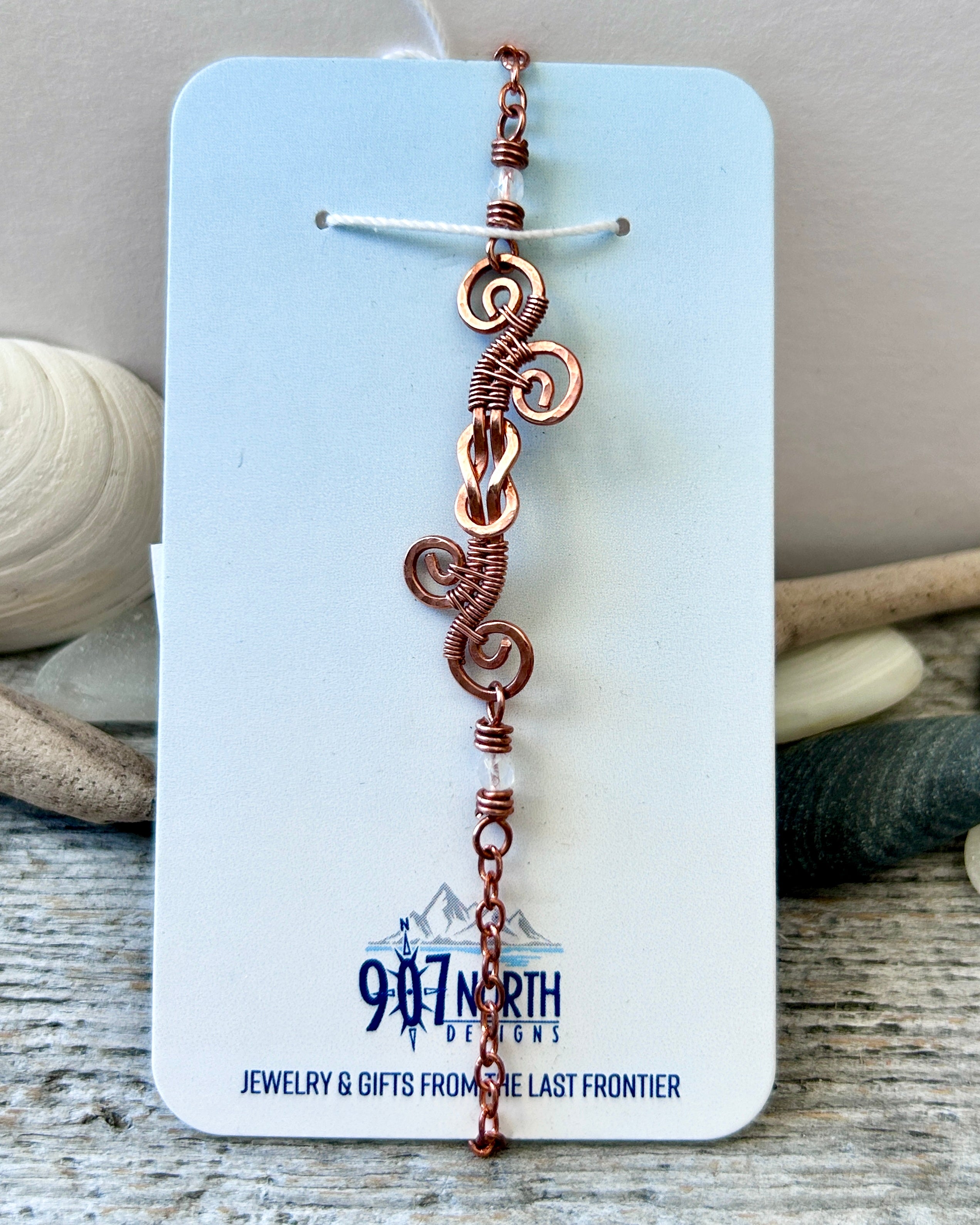 #1255 907 lmm Copper Swirly Square Knot Bracelet with white 3mm beads