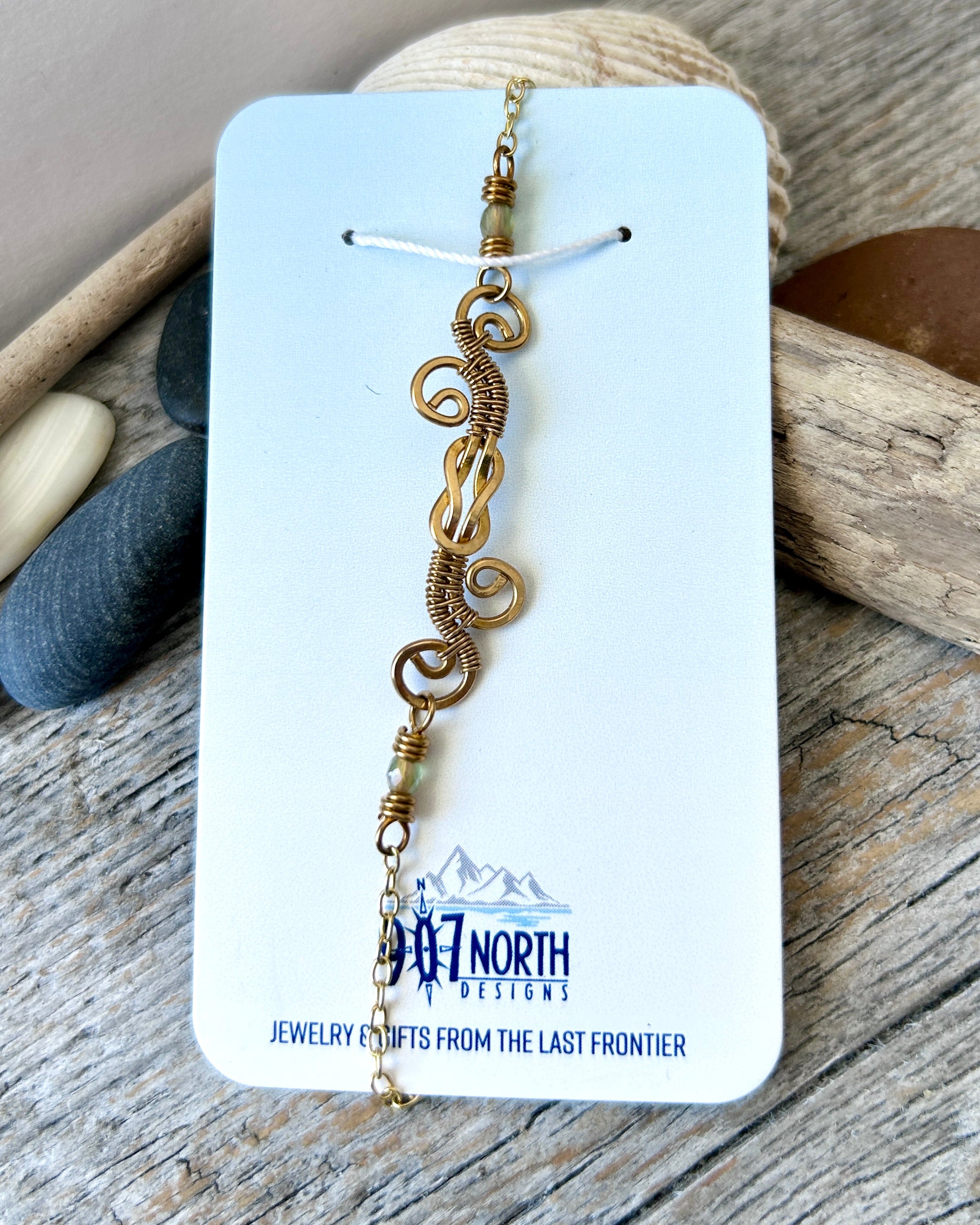 #1258 907 lmm Brass Swirly Square Knot Bracelet