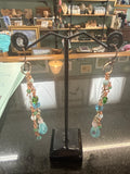 Earrings: Copper chain with green, opalescent and blue glass accents. E16