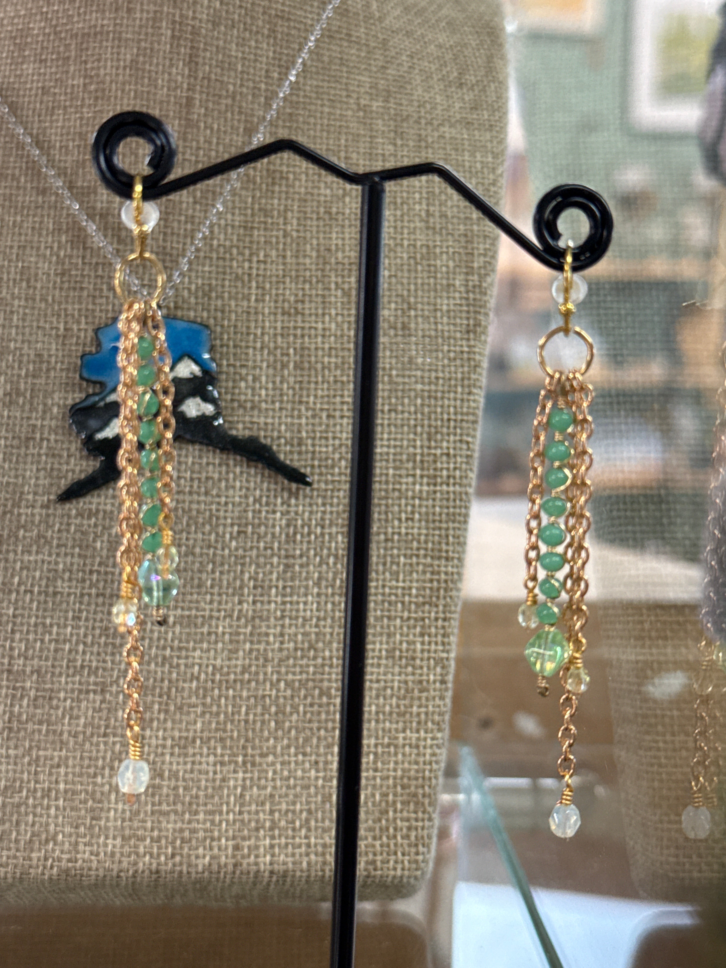 Earrings: Stack of vintage glass beads and hand wrapped brass findings. E14