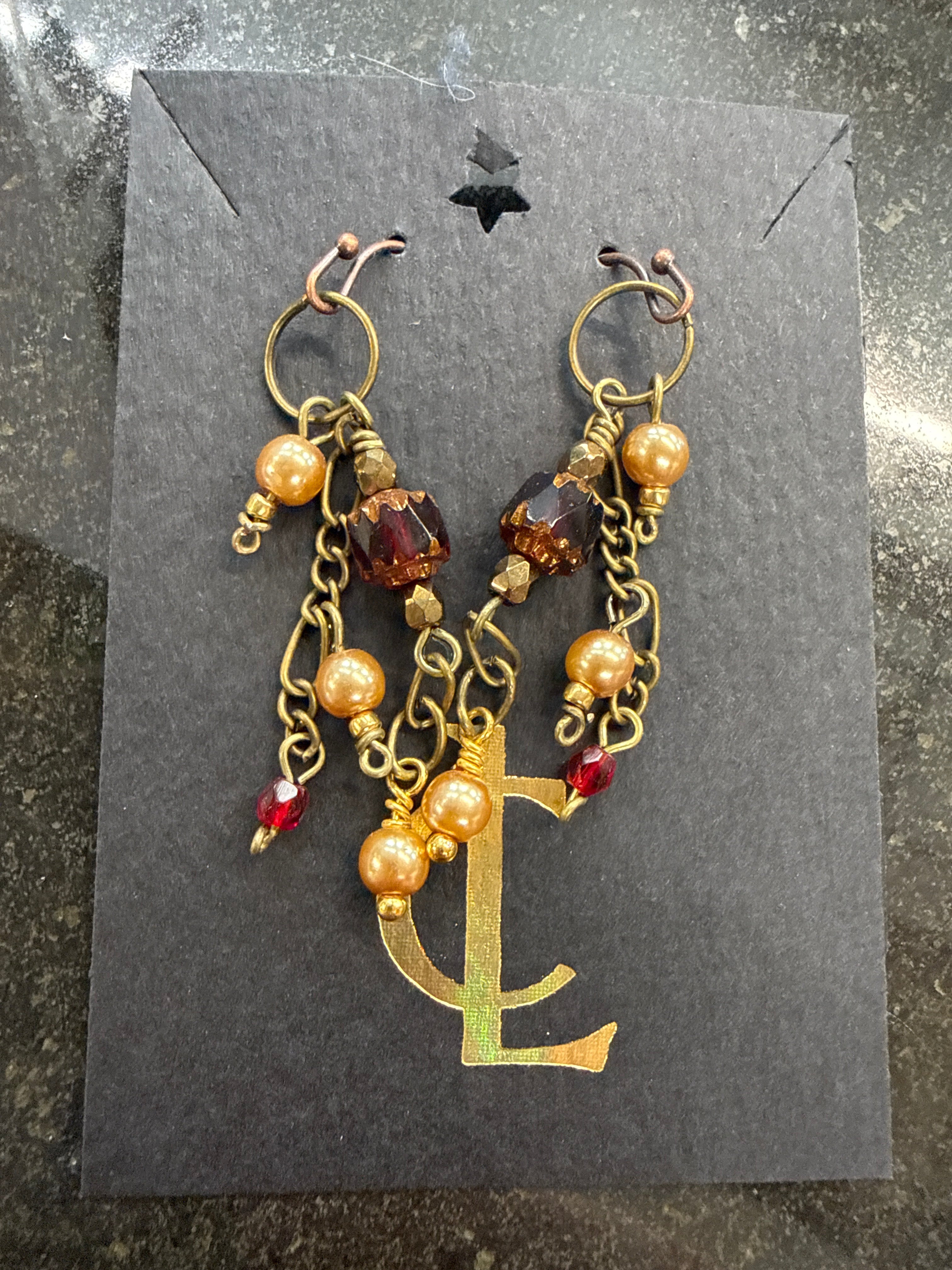 Earrings: Red Czech glass beads with vintage faux pearls on antiqued brass chain. E24