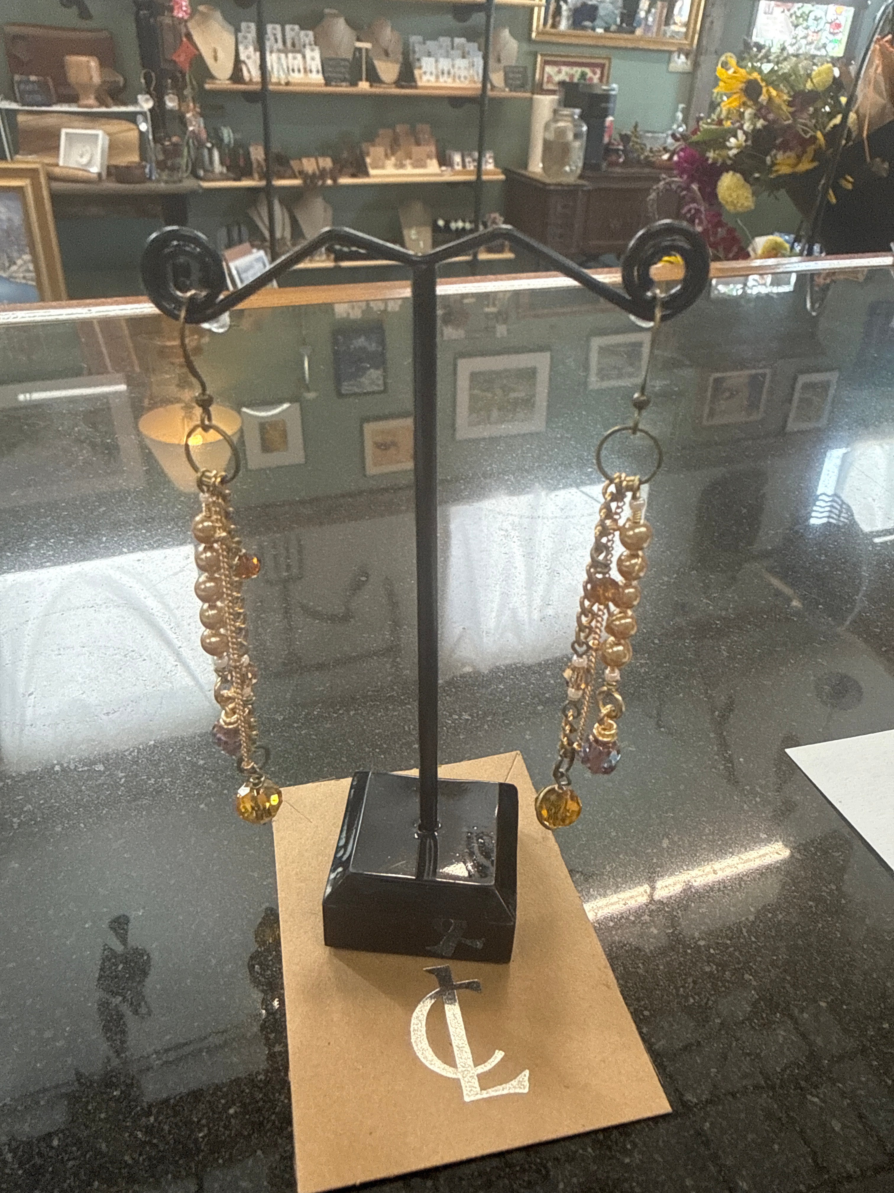 Earrings: Opalescent and glass beads with Clear Yellow flower feature. Brass chain. E20