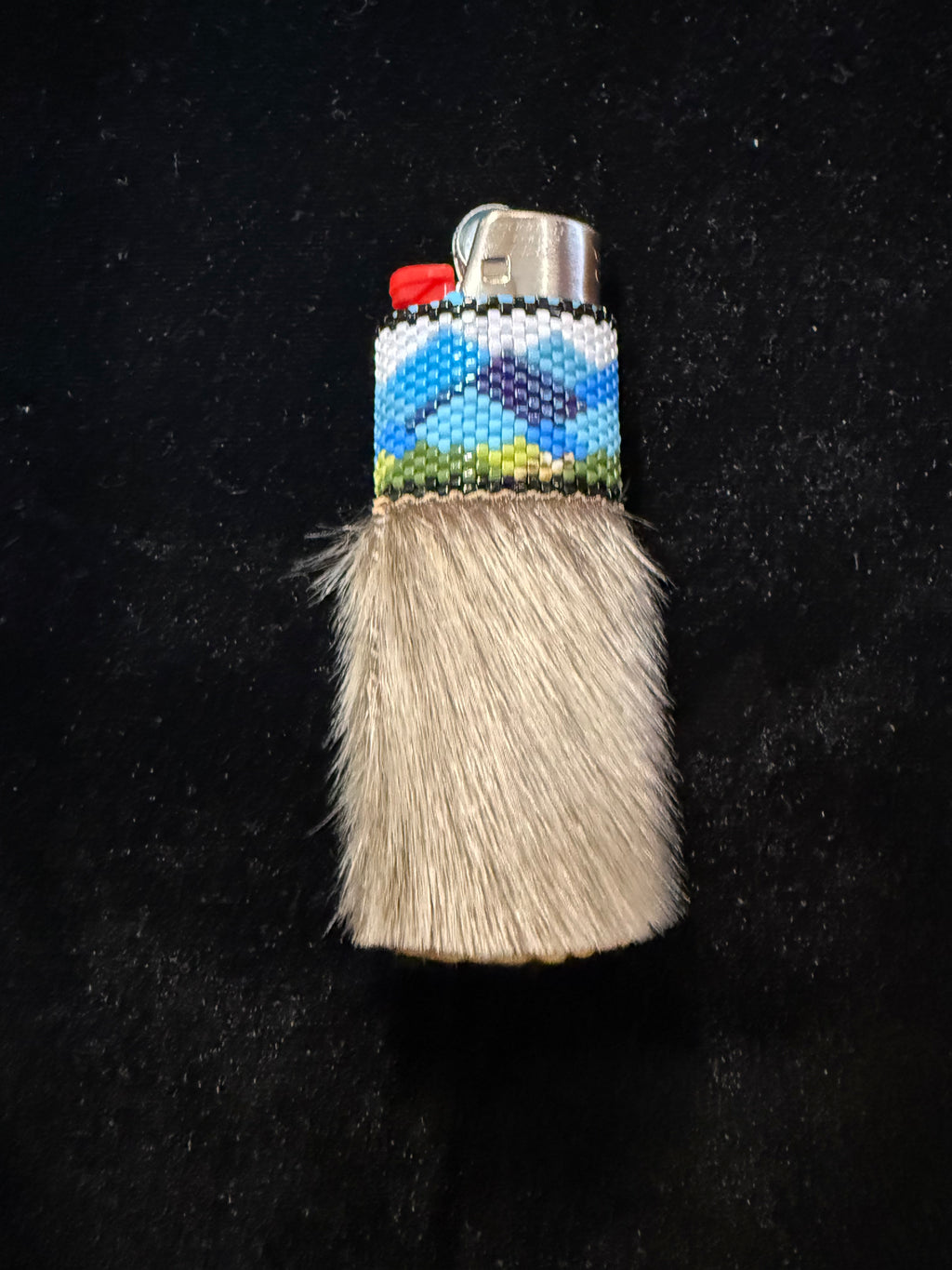 Seal fur, hand beaded lighter with moose hide