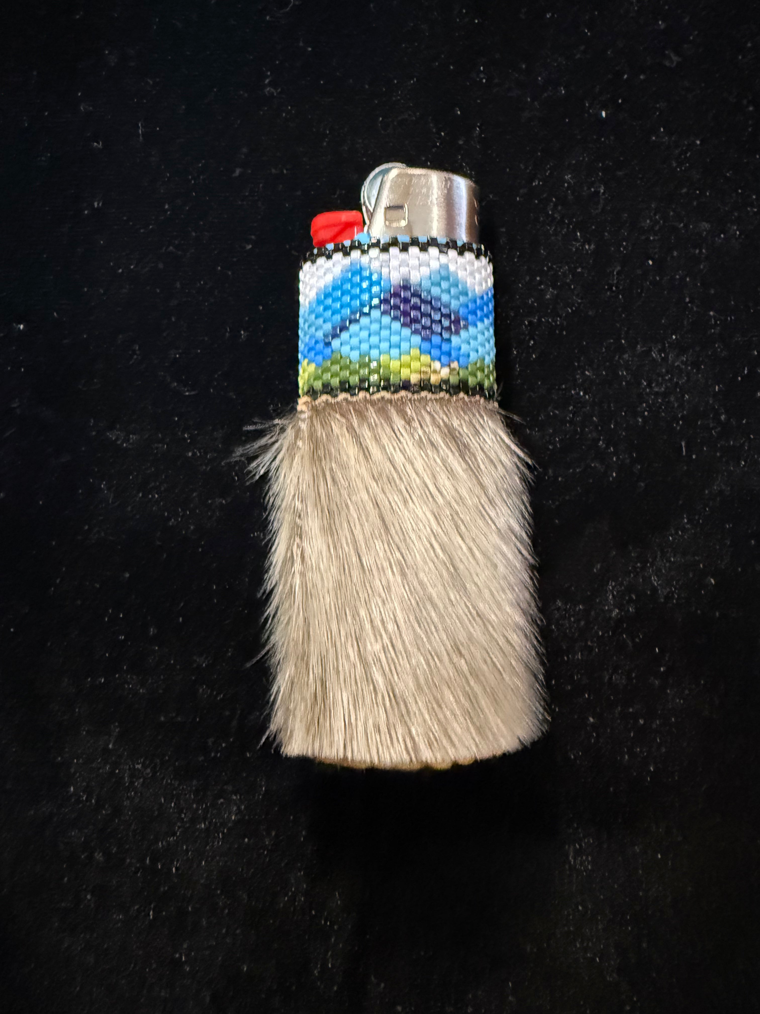 Seal fur, hand beaded lighter with moose hide