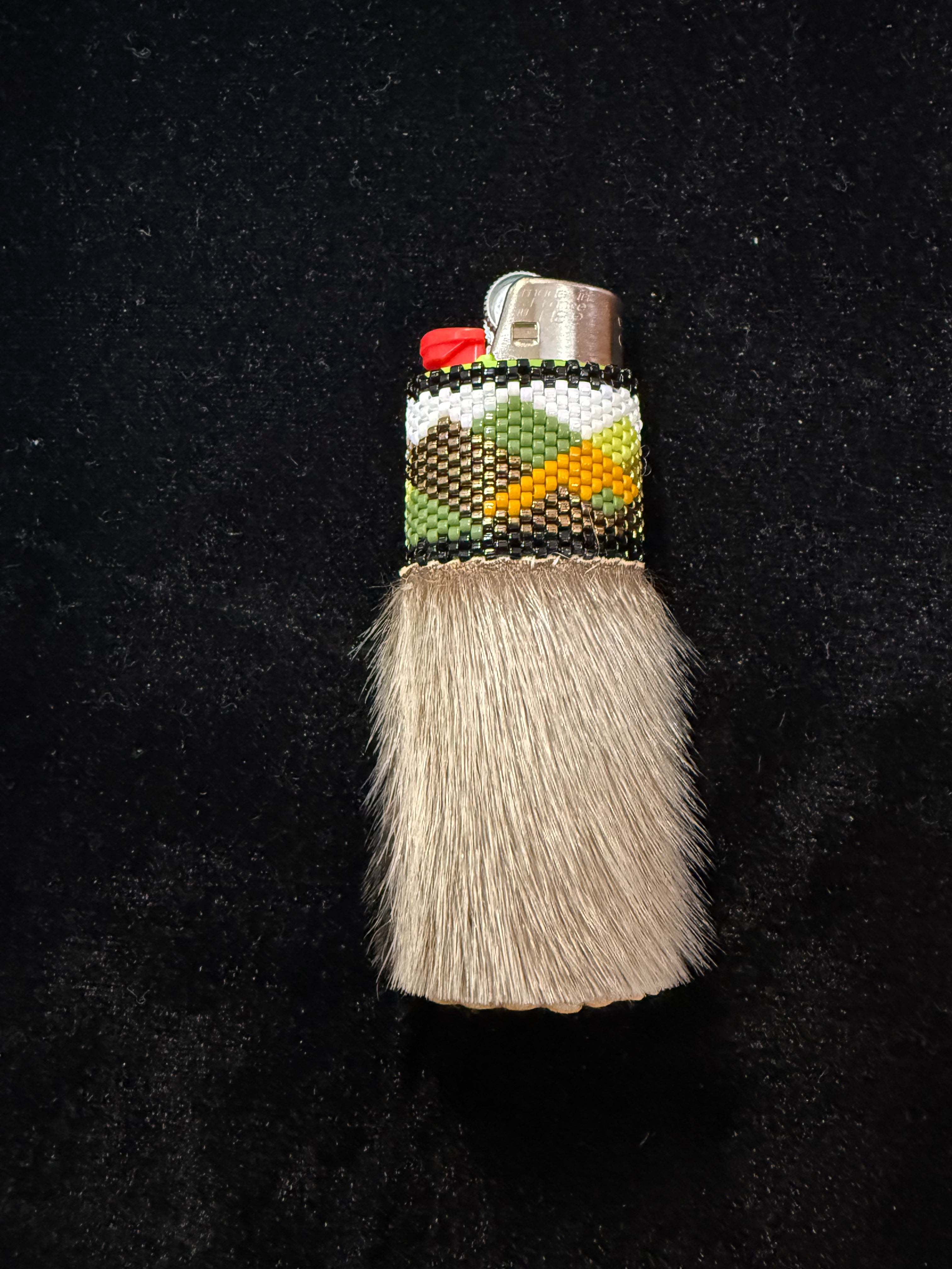 Seal fur, hand beaded lighter with moose hide